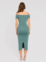 Back view of light green short-sleeve midi dress with slit.