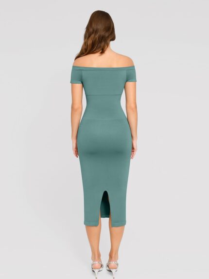 Back view of light green short-sleeve midi dress with slit.
