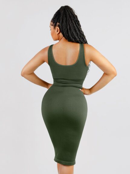 Back view of dark green ribbed midi dress.