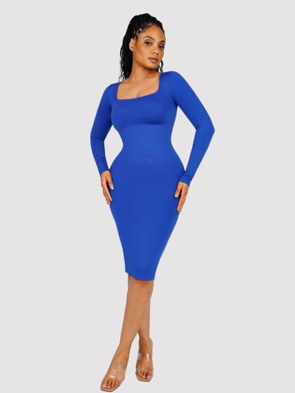 Woman in royal blue long-sleeve bodycon midi dress.