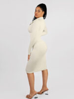 Woman in white retro shirt dress with front slit.