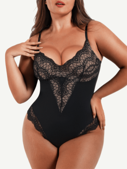 Woman wearing the black lace-front low-back thong bodysuit, front view.