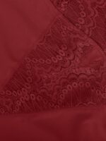 Dark red lace leg opening detail with scalloped edge.