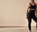 Woman in black shaping leggings and sports top, studio hero banner.