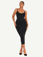 Woman in black seamless V-neck shaper dress, front view.