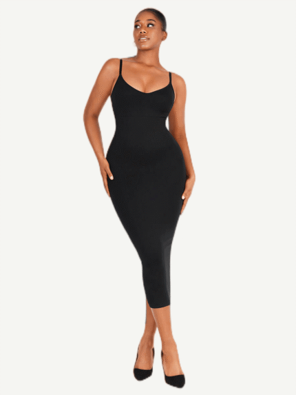 Woman in black seamless V-neck shaper dress, front view.