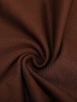 Close-up of dark brown seamless shaping fabric.