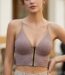 Women’s dusty rose pink ribbed wire-free bralette showing center-front zipper, deep V-neckline, and contrast beige binding.