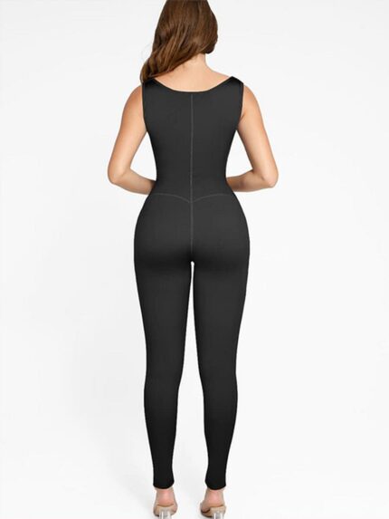 Back view of the black sauna sports jumpsuit showing full-length leg fit.