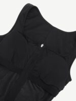 Close-up of the front zipper and bust cups on the black sauna jumpsuit.