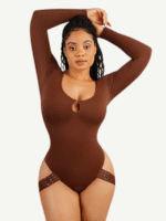 Woman in dark brown long-sleeve shaping bodysuit with hook leg straps, front view.