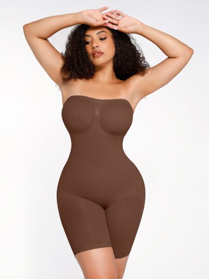 Woman in dark brown strapless shaping bodysuit, front view.