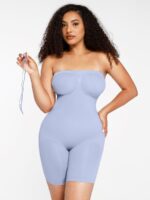 Woman in light blue strapless shaping bodysuit, front view.