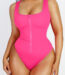 Woman in hot pink zip-front one-piece swimsuit, front view.