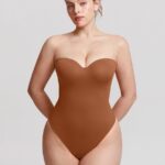 Woman wearing the caramel brown underwire strapless thong bodysuit, front view.