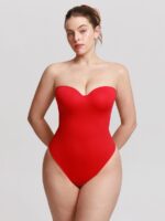 Woman wearing the vivid red underwire strapless bodysuit.